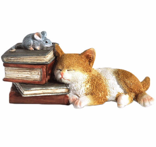 Kitten Napping on Books Box